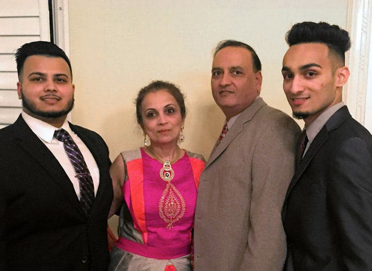 Our owner, Dhiren Pathak, poses with his wife and sons